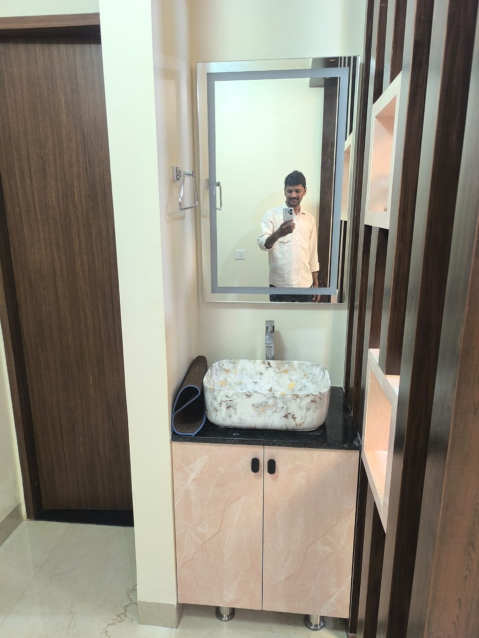 Bathroom vanity with pink marble cabinet