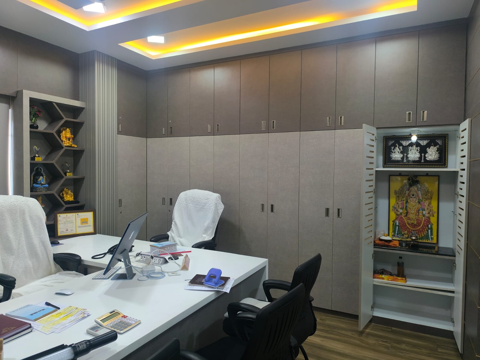 MD cabin with storage cabinets and mandir unit