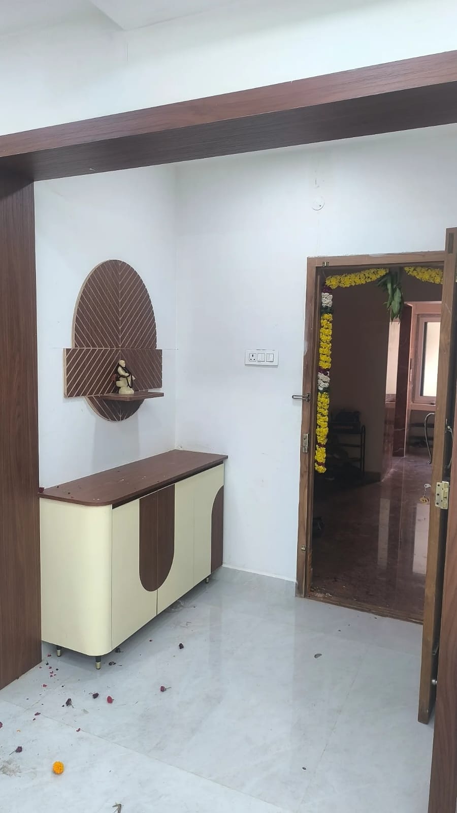 Pooja unit with cream and brown cabinet